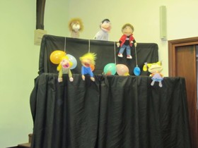 Image shows use of puppets in worship.